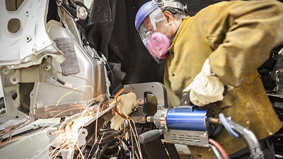 Collision Center Technician Repairing Vehicle | Arlington Toyota in Palatine IL
