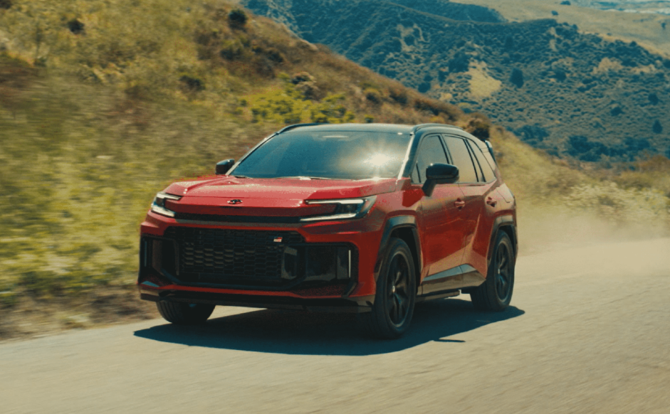 Red 2026 Toyota RAV4 driving on road