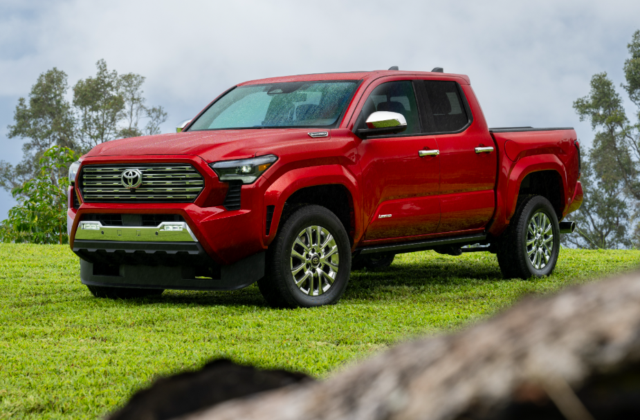 Red 2026 Toyota Tacoma parked in grass