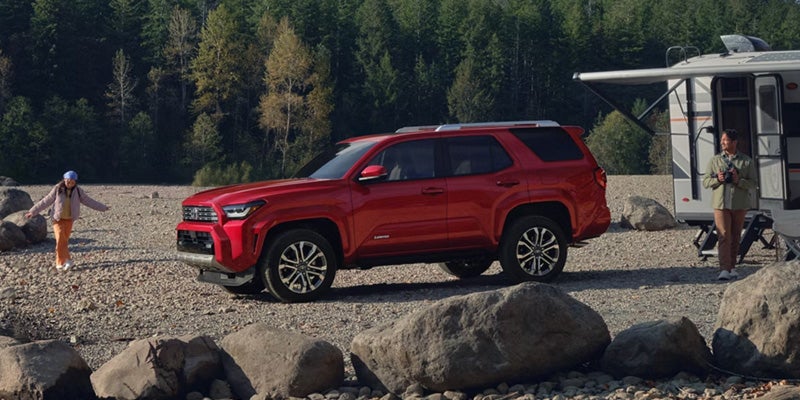 Red Toyota 4Runner parked on beach